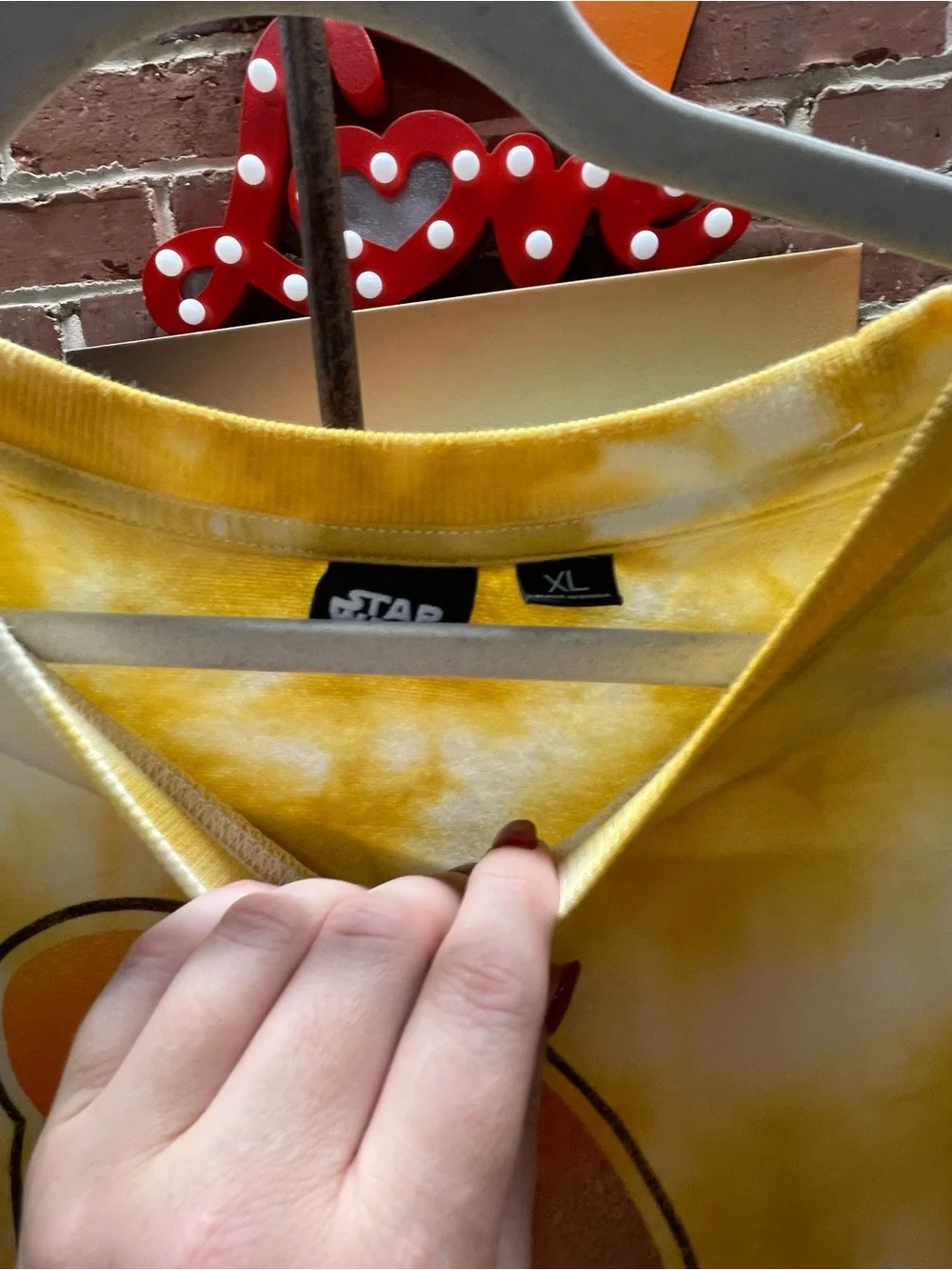 yellow and white tie-dye Star Wars crewneck sweatshirt featuring a retro graphic